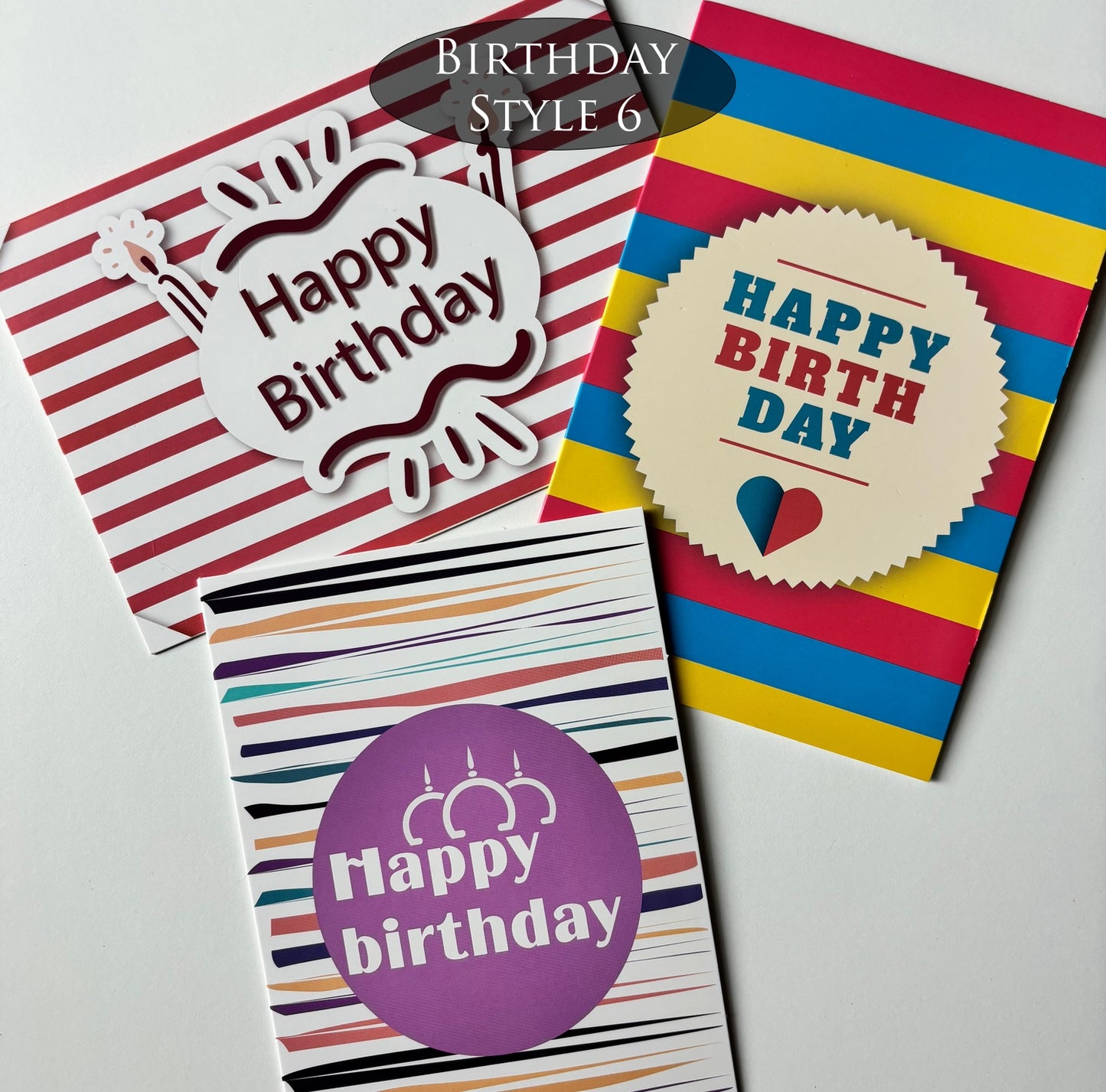 Three striped, colorful birthday cards with 'Happy Birthday' text on a white background