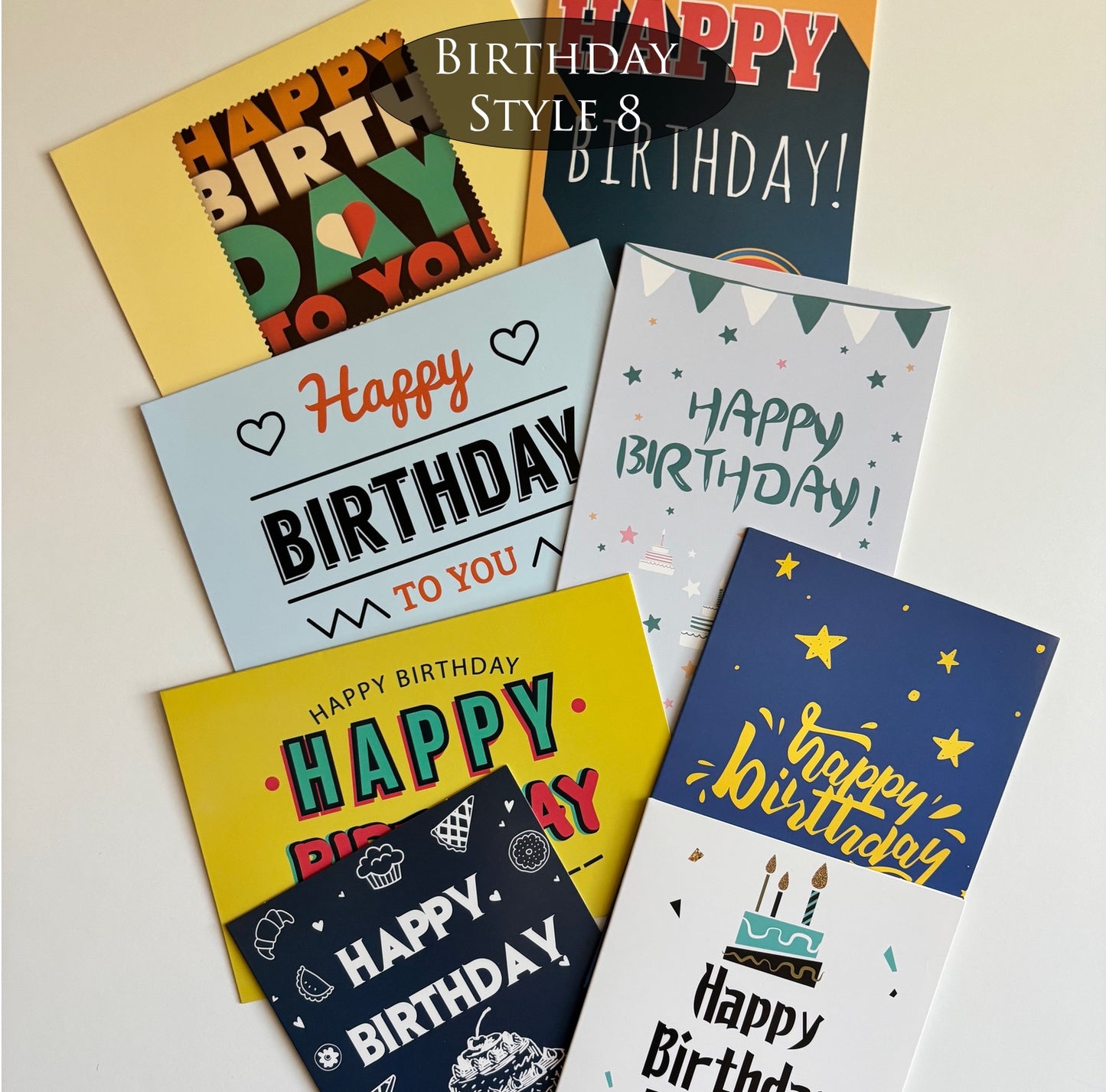 Collection of colorful, masculine-colored birthday cards with various designs on a light background