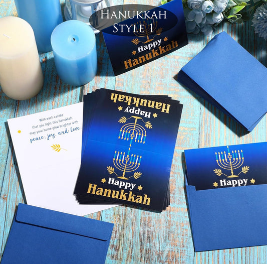 Hanukkah-themed greeting cards with blue envelopes on a wooden surface.
