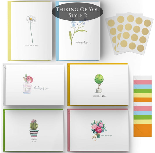 Collection of greeting cards with floral designs and the words "Thinking of You"